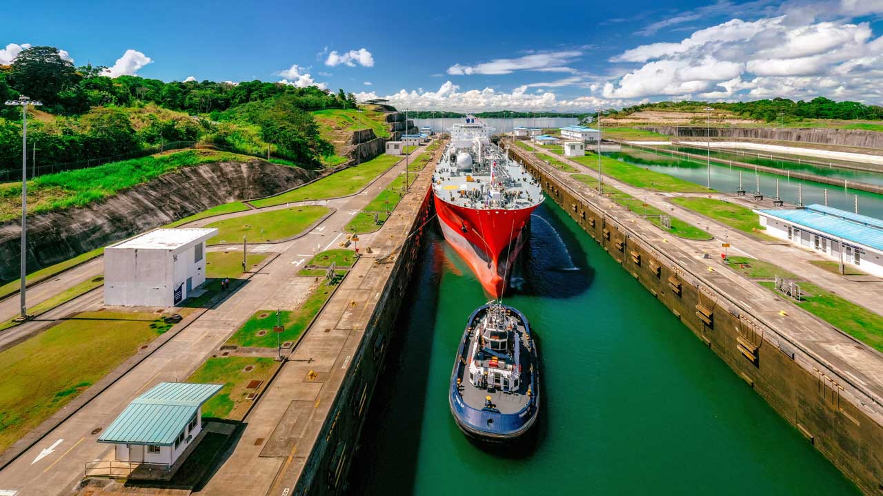 Cargo ship and tugboat in the Panama Canal locks