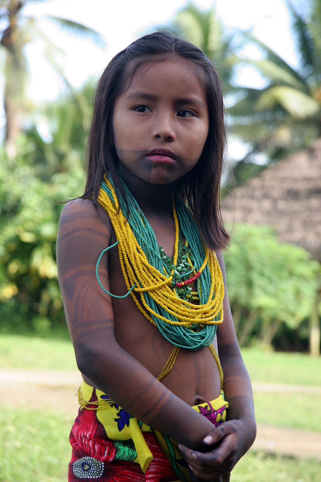 Emberá girl wearing traditional beaded necklaces