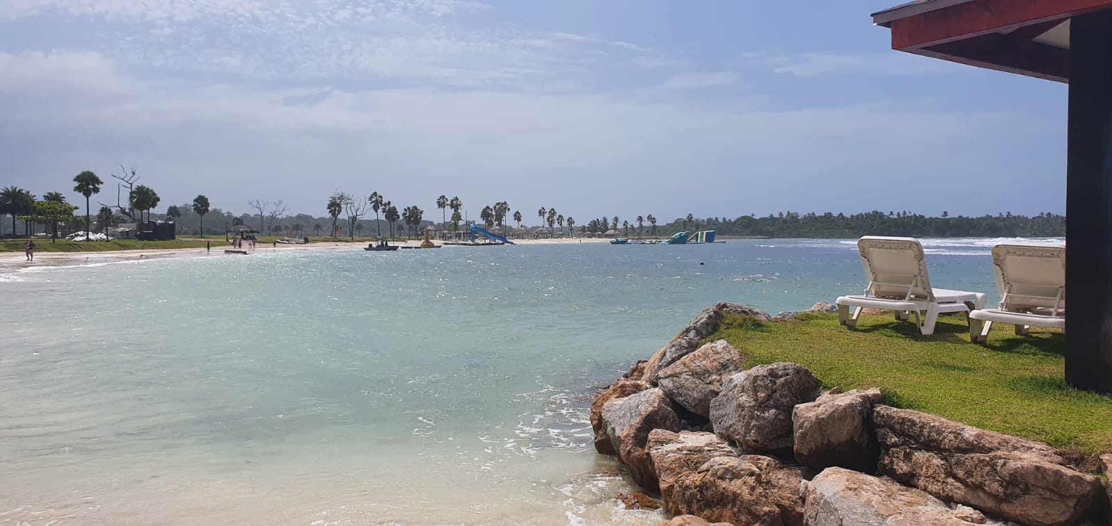 Calm Caribbean water and lounge chairs at Escondido Beach